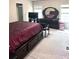 This main bedroom features a dark wood dresser, large television, and plush carpet at 635 Crosswinds Cir, Marietta, GA 30008
