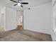 Spacious bedroom featuring a ceiling fan and neutral carpeting at 1250 Parkwood Se Cir # 3101, Atlanta, GA 30339