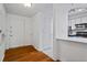 Bright entryway with white trim, hardwood floors, and a view into the updated kitchen at 1250 Parkwood Se Cir # 3101, Atlanta, GA 30339