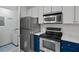 Updated kitchen with stainless appliances and adjacent laundry room at 1250 Parkwood Se Cir # 3101, Atlanta, GA 30339