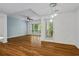 Bright living room featuring hardwood floors, a ceiling fan, and a sliding glass door to a balcony at 1250 Parkwood Se Cir # 3101, Atlanta, GA 30339
