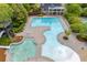 Overhead view of the luxurious aquatic center featuring multiple pools, a water slide and a clubhouse with lounge chairs at 162 Greenbrier Way, Canton, GA 30114