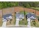 Aerial view of three homes on a street with manicured lawns, landscaping, and a swimming pool in one of the backyards at 162 Greenbrier Way, Canton, GA 30114