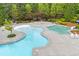 Aerial view of the various pool areas, including shallow wading area, a water slide, and lounge chairs surrounded by landscaping at 162 Greenbrier Way, Canton, GA 30114