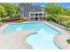 An aerial shot of the community pool with lap lanes and lounge chairs, next to the clubhouse with its stone base at 162 Greenbrier Way, Canton, GA 30114