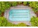 Aerial shot of the community lap pool, surrounded by trees and chairs for relaxing at 162 Greenbrier Way, Canton, GA 30114