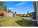 Spacious backyard with a shed, basketball hoop, and ample green space, perfect for outdoor activities and relaxation at 162 Greenbrier Way, Canton, GA 30114