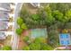 Aerial view of a basketball court surrounded by lush trees, offering a private and serene playing environment at 162 Greenbrier Way, Canton, GA 30114