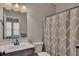 Clean bathroom with a decorative shower curtain and a view of the bedroom at 162 Greenbrier Way, Canton, GA 30114