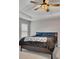 Large bedroom with a ceiling fan and tray ceilings at 162 Greenbrier Way, Canton, GA 30114