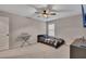 Bedroom featuring ceiling fan, window, and a small piano at 162 Greenbrier Way, Canton, GA 30114