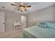 Comfortable bedroom featuring a makeup vanity and ceiling fan at 162 Greenbrier Way, Canton, GA 30114