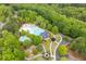 Aerial view of a resort-style community pool area with multiple pools, and green landscaping at 162 Greenbrier Way, Canton, GA 30114