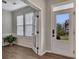 Bright foyer featuring hardwood floors, white trim, and a view of the front yard through the glass door at 162 Greenbrier Way, Canton, GA 30114