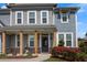 Inviting front porch of home #162, with stone accents, wood pillars, and lush landscaping at 162 Greenbrier Way, Canton, GA 30114