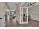 Hallway view of the home office, living room and hardwood flooring throughout the first floor at 162 Greenbrier Way, Canton, GA 30114