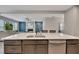 Modern kitchen featuring an island with seating and stainless steel appliances at 162 Greenbrier Way, Canton, GA 30114