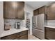Kitchen with stainless steel refrigerator and open view of walk-in pantry at 162 Greenbrier Way, Canton, GA 30114