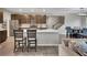 Open kitchen with stainless appliances, a large island, and a view into the dining area at 162 Greenbrier Way, Canton, GA 30114