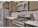 Stainless steel appliances, countertops, and cabinetry in a gourmet kitchen at 162 Greenbrier Way, Canton, GA 30114