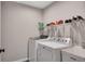 Practical laundry area with washer, dryer, and utility sink at 162 Greenbrier Way, Canton, GA 30114
