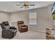 Second living room with recliners, tv, and ceiling fan at 162 Greenbrier Way, Canton, GA 30114