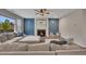 Living room with a fireplace, blue accent wall, and large sectional sofa at 162 Greenbrier Way, Canton, GA 30114