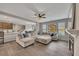 Bright, open living room featuring hardwood floors and a comfortable sectional sofa at 162 Greenbrier Way, Canton, GA 30114
