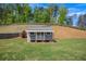 Charming shed in a spacious backyard, providing extra storage with a well-maintained lawn at 162 Greenbrier Way, Canton, GA 30114