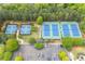 Community tennis courts offer a place for friendly competition and socializing surrounded by trees at 162 Greenbrier Way, Canton, GA 30114
