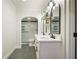 Modern bathroom with double sinks, white cabinets, and sleek glass-enclosed shower at 25 Ivy Gates Ne, Atlanta, GA 30342