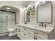 Modern bathroom with double sinks, white cabinets, and sleek glass-enclosed shower at 25 Ivy Gates Ne, Atlanta, GA 30342