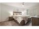 Cozy bedroom featuring a comfortable bed, ceiling fan and plantation shutters for a bright, inviting space at 25 Ivy Gates Ne, Atlanta, GA 30342