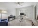 Neutral bedroom provides ample space for bedroom/office with a ceiling fan, neutral carpet and plantation shutters at 25 Ivy Gates Ne, Atlanta, GA 30342