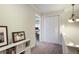Upstairs hallway featuring storage, neutral decor and leading to other rooms at 25 Ivy Gates Ne, Atlanta, GA 30342