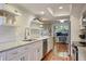 Modern kitchen featuring white cabinets, stainless steel appliances, marble countertops, and an open layout at 25 Ivy Gates Ne, Atlanta, GA 30342