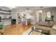 Open concept floor plan featuring hardwood floors and living room leading to the kitchen with breakfast bar at 25 Ivy Gates Ne, Atlanta, GA 30342