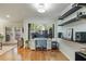 Bright home office space with natural light, hardwood floors, a modern desk setup, and built-in shelving at 25 Ivy Gates Ne, Atlanta, GA 30342