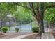 Tennis court surrounded by mature trees at 25 Ivy Gates Ne, Atlanta, GA 30342