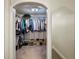 Spacious walk-in closet with built-in shelving and ample storage for clothes and shoes at 25 Ivy Gates Ne, Atlanta, GA 30342