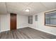 Spacious basement area with wood-look flooring, bright light, and two windows at 4065 Maxanne Nw Dr, Kennesaw, GA 30144