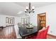 Open-concept dining area with a view into the living room and adjacent kitchen at 4065 Maxanne Nw Dr, Kennesaw, GA 30144