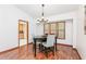 Bright dining room with hardwood floors, natural light, and access to an adjacent kitchen at 4065 Maxanne Nw Dr, Kennesaw, GA 30144