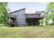 Exterior of home featuring two decks and a large, green, grassy yard at 4065 Maxanne Nw Dr, Kennesaw, GA 30144