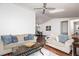 Inviting living room with hardwood floors, neutral sofas, and views into the dining area at 4065 Maxanne Nw Dr, Kennesaw, GA 30144