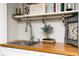 Charming sink area featuring a wooden countertop, decor, and under-shelf storage at 4065 Maxanne Nw Dr, Kennesaw, GA 30144