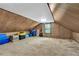 Spacious unfinished attic area offers potential for storage or future expansion with natural light and neutral carpet at 4702 Sequoia Sw Dr, Lilburn, GA 30047