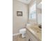 Cozy bathroom features patterned tile floors, and a marble countertop sink at 4702 Sequoia Sw Dr, Lilburn, GA 30047
