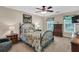 Comfortable bedroom features a decorative iron bed frame, floral bedding, and coordinated furniture at 4702 Sequoia Sw Dr, Lilburn, GA 30047