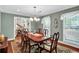 Formal dining room with hardwood floors, traditional furnishings, and a large window at 4702 Sequoia Sw Dr, Lilburn, GA 30047